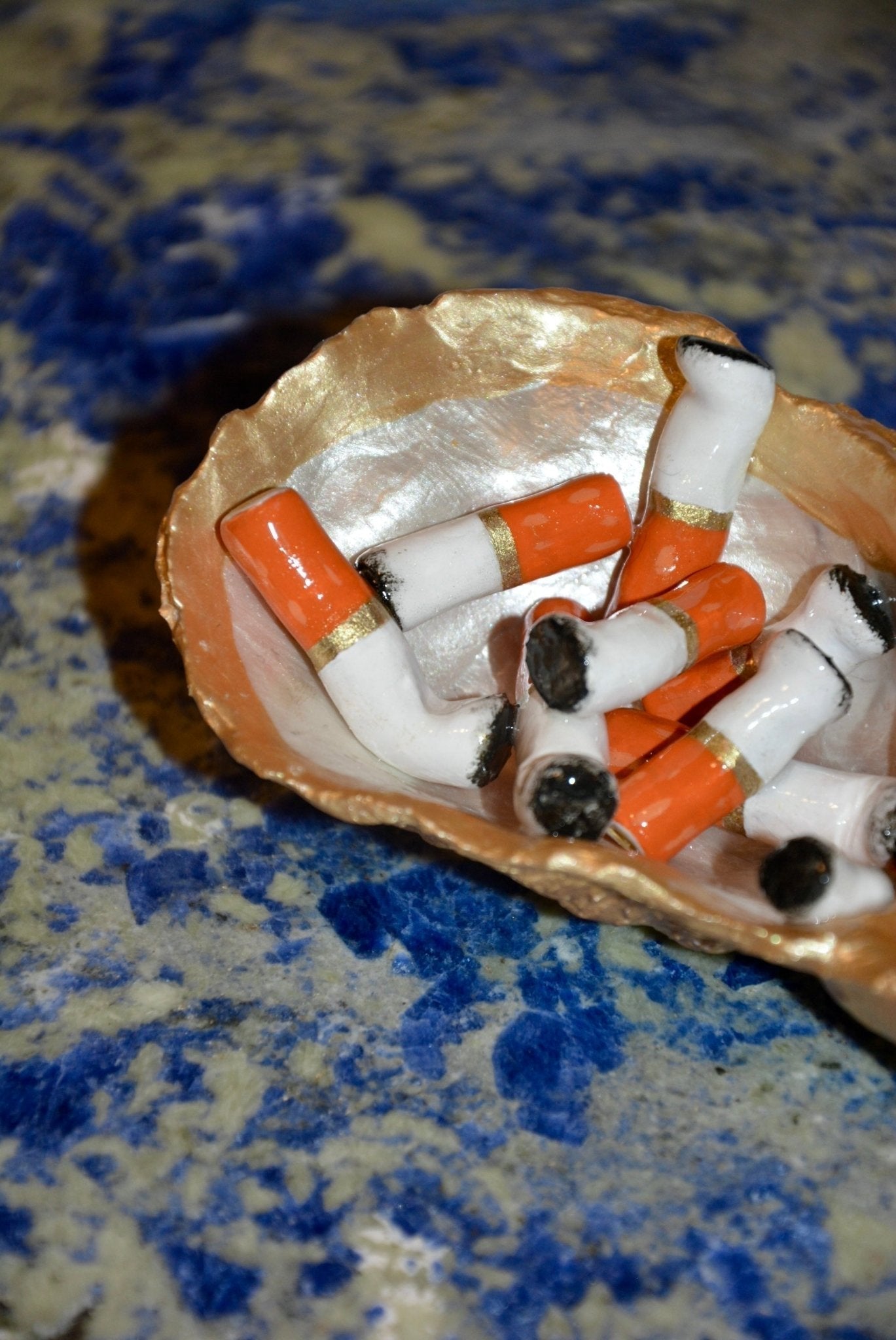 OYSTER SHELL CIGARETTE SCULPTURE - Knife Shift